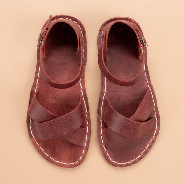 Rote, überkreuzte Barfußsandalen