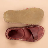 Rote, überkreuzte Barfußsandalen